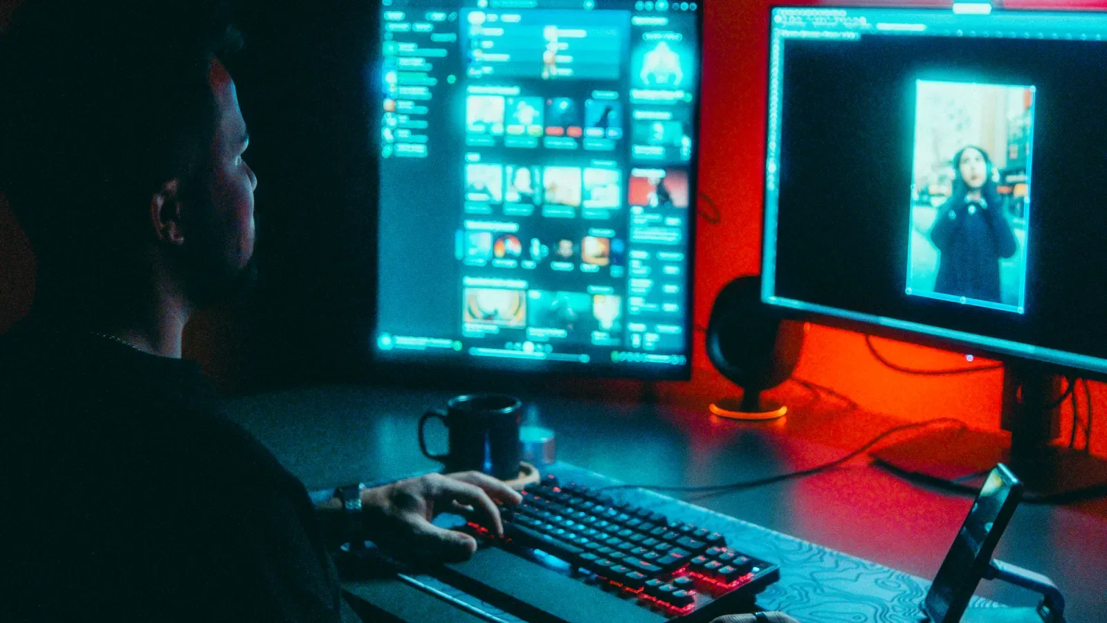 Trader monitors displaying financial charts in a dark room
