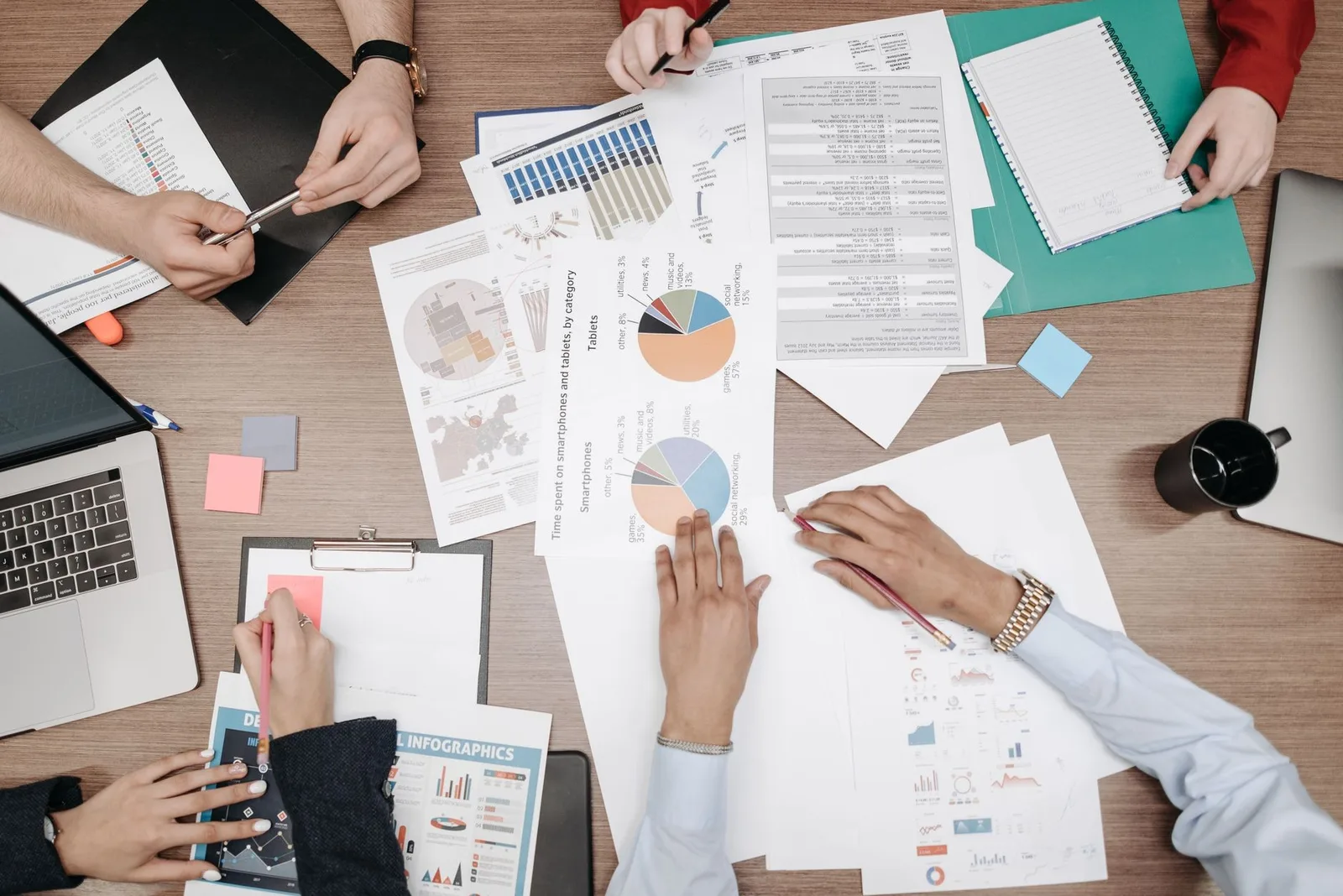 Business analysts reviewing charts in a meeting