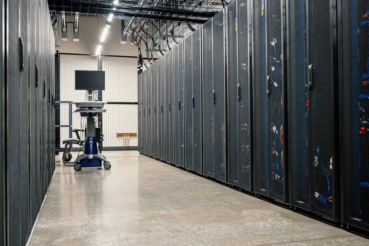 Data center server racks in a corridor
