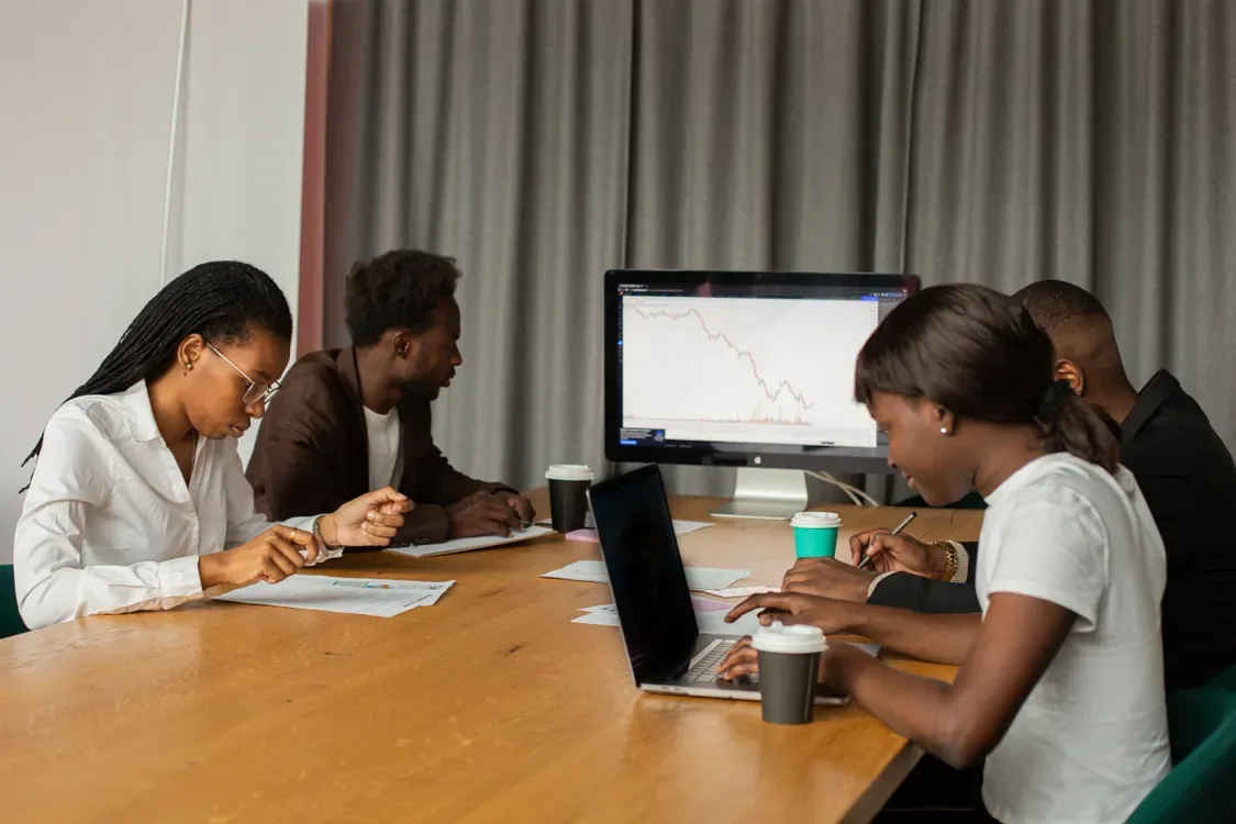 Operations team monitoring screens in a control room